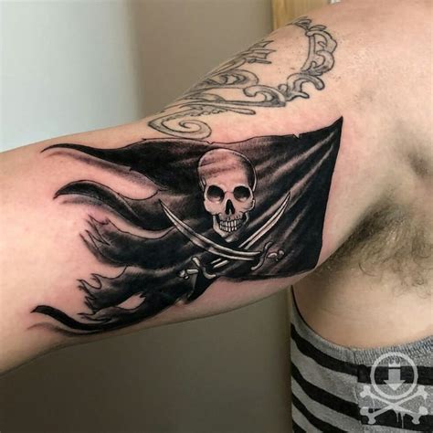 Rad Jolly Roger flag tattoo by Chris Curtis. #12ozstudios #team12oz # ...