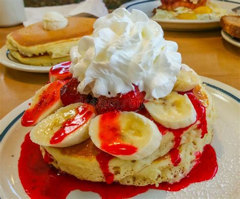 Delicious American Pancakes with Bananas Strawberry Sauce and Whipped ...