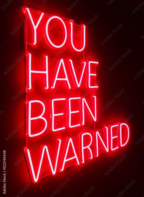 Red neon sign on dark background Stock Photo | Adobe Stock