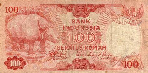 Uang kertas Rp. 100 (seratus) Rupiah Indonesia bergambar Badak Jawa ...