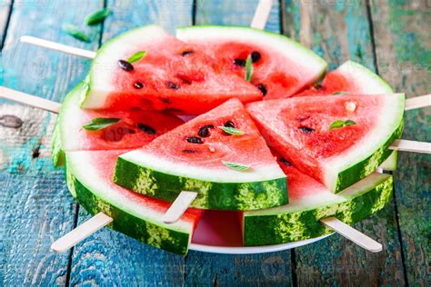 Slices of fresh juicy watermelon on plate closeup 736911 Stock Photo at ...