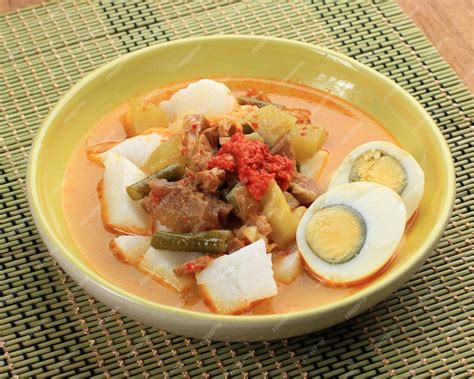 Premium Photo | Lontong sayur indonesian cuisine compressed rice cake ...