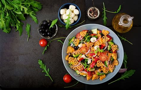 Free Photo | Pasta colored farfalle salad with tomatoes, mozzarella and ...