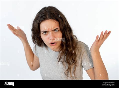 Close up portrait of a pretty young caucasian girl with an angry face ...