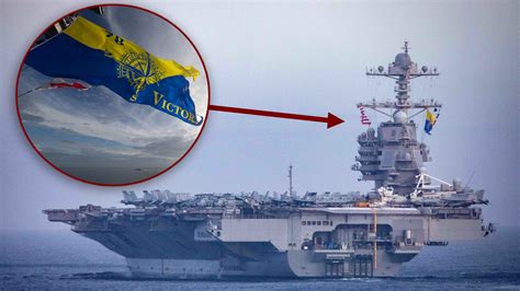 Navy aircraft carrier USS Gerald R. Ford flies new battle flag at sea