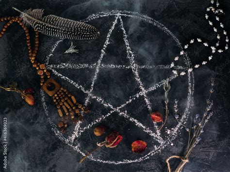 top view of the demon summoning ritual. a pentagram painted on a stone ...