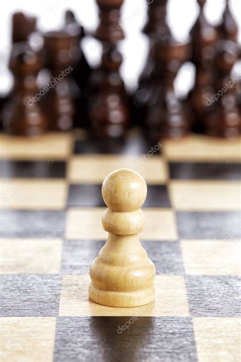 Wooden pawn chess piece white on chessboard — Stock Photo © Greatstock ...