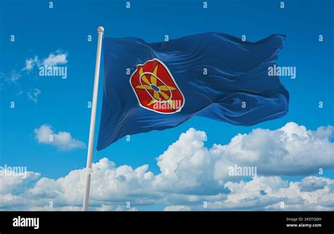 flag of Baltic Finns Kven people at cloudy sky background, panoramic ...