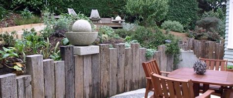 Vertical sleepers | Sleeper retaining wall, Backyard retaining walls ...