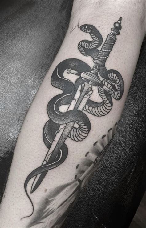 Snake And Dagger Tattoo | InkStyleMag