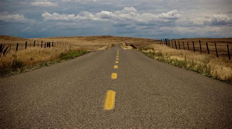 Empty Two Lane Highway by Erik Lykins