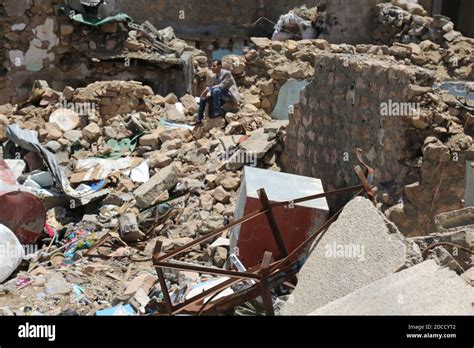 Taiz / Yemen - 13 Apr 2017 : A Yemeni man Sitting past a house ...