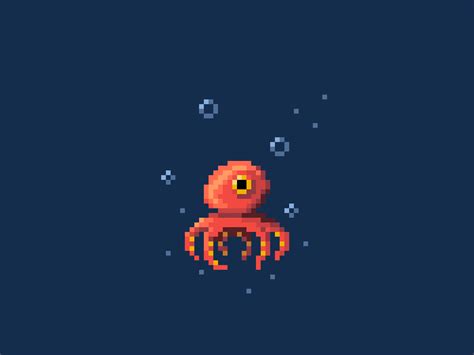 an orange crab floating in the ocean on top of blue water with bubbles ...