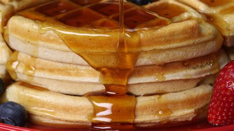 Picture of Pouring Maple Syrup On Waffles - Free Stock Photo