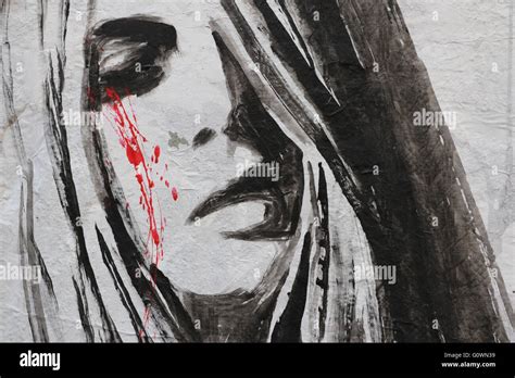 Street Art in Paris representing a sad woman crying blood Stock Photo ...