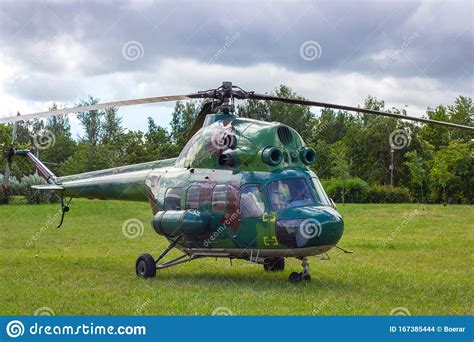 Green Military Helicopter is Landing in the City Street Park. Stock ...