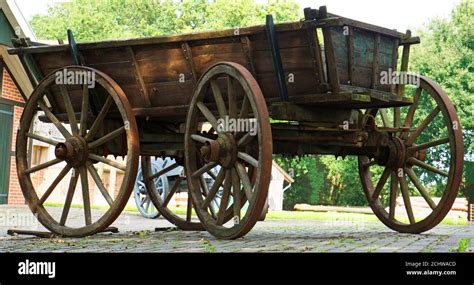 Old wooden farm wagon with traditional wheels made of wood and iron ...