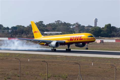 DHL Boeing 757 freighter tail breaks off after skidding off runway ...