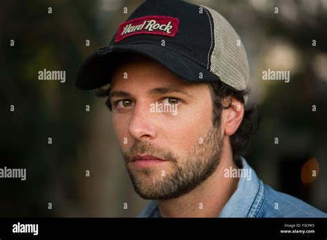 Man wearing baseball cap, portrait Stock Photo - Alamy