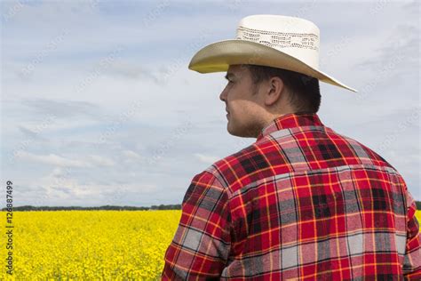 side view of a man wearing a cowboy hat Stock Photo | Adobe Stock