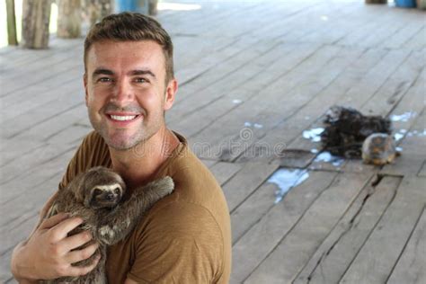 Sloth Hugging a Handsome Man Stock Image - Image of central, happy ...