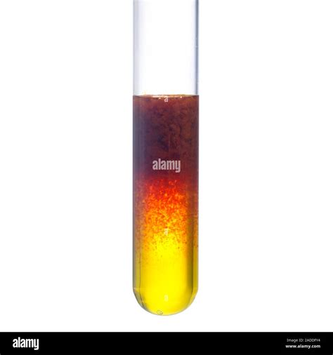 Iron (III) hydroxide precipitation. Test tube containing sodium ...