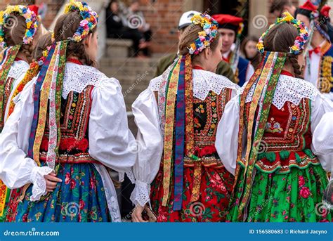 Traditional Polish Folk Costumes On Parade In Krakow Main Market Square ...