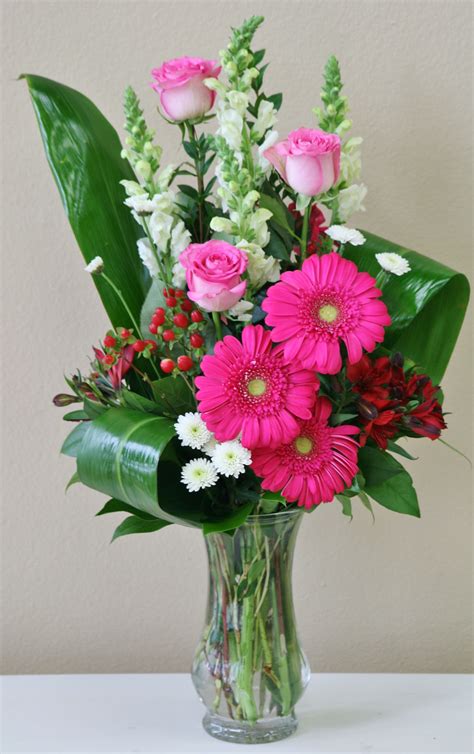 Pink roses and pink gerberas in this vase of pink and white flowers by ...