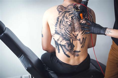 Aggregate 76+ tiger face back tattoo - vova.edu.vn