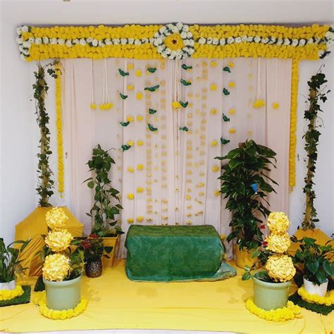 a decorated stage with flowers and greenery