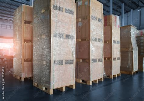 Interior of storage warehouse with stack wooden crates. shipping ...