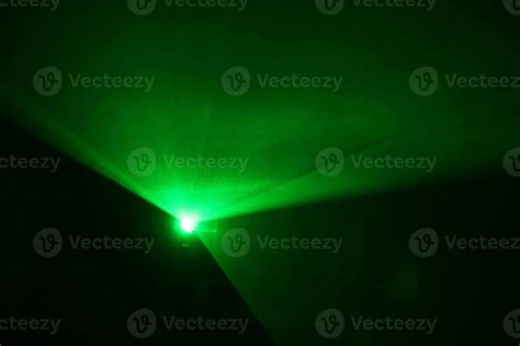 green beam laser beam on dark background 20465710 Stock Photo at Vecteezy