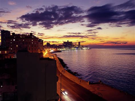 Dramatic sunset over the Malecon, Havana, Cuba Photograph by Sophie ...