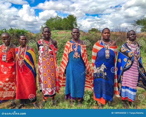 Masai Women in Multi-colored Cotton Dresses and Beaded Jewelry ...