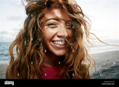 Wind blowing hair of Caucasian woman on beach Stock Photo - Alamy