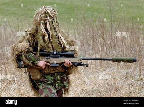 British Infantryman with a long range sniper rifle L115A3 which has a ...