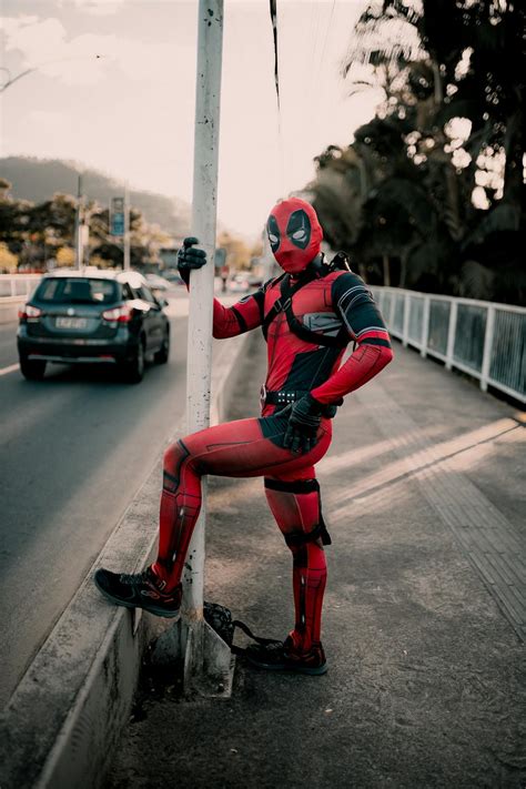 Person in Deadpool Costume on Bridge · Free Stock Photo