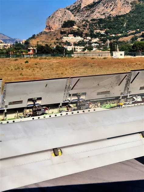 Detail of the Wing of an Airplane with Flaps in Motion Stock Photo ...