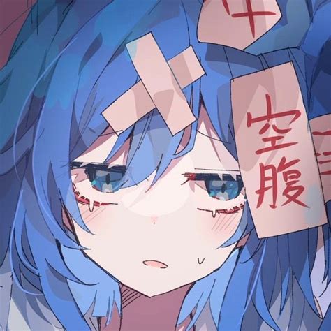 an anime character with blue hair and cross on her head