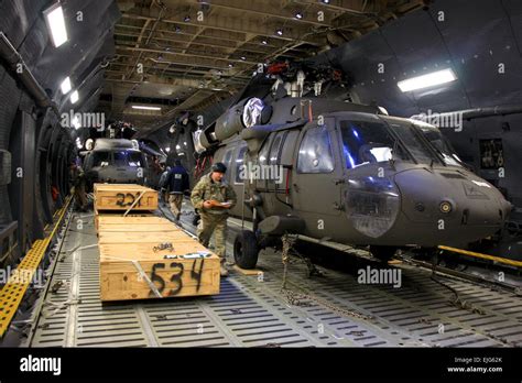 UH64 Black Hawk helicopters await offload from a Lockheed C-5 Galaxy at ...