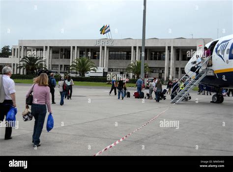 Air passengers heading towards the Arrivals Hall at Jerez airport ...