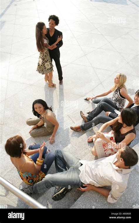 Aerial view of young people sitting on steps Stock Photo - Alamy