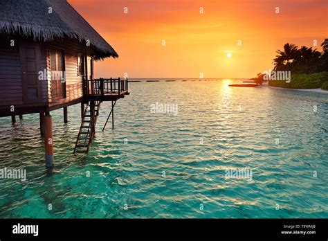 Sunset at tropical beach, Maldives Island landscape hotel Stock Photo ...