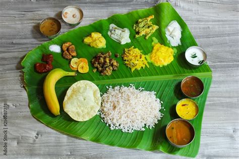 Traditionam Onam Sadya / Feast served in fresh banana leaf Stock Photo ...