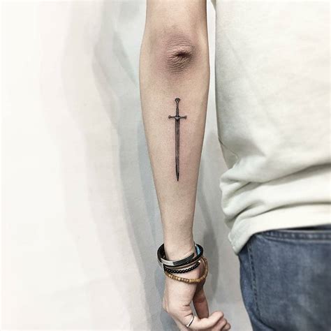 Little sword tattoo on the forearm - Tattoogrid.net