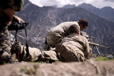 A U.S. Army sniper team set up a rifle during a mission - NARA & DVIDS ...