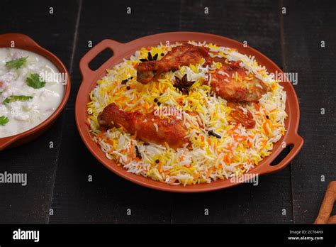 Chicken biryani , Tandoori chicken with basmathi rice and raita as side ...