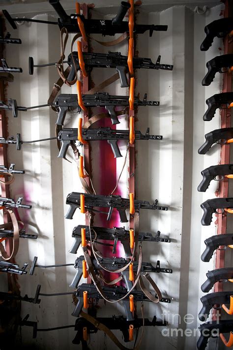 Akm Assault Rifles Lined Up On The Wall Photograph by Terry Moore ...