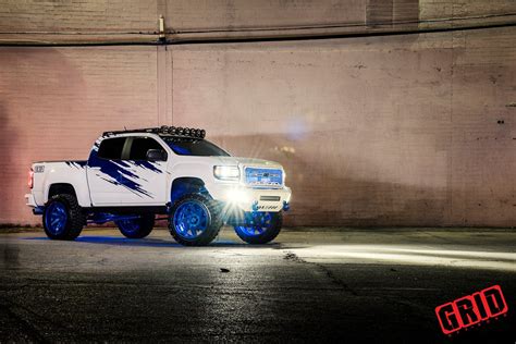 Mall Crawler White Lifted GMC Sierra Rocking Blue Grid Off-Road Rims ...