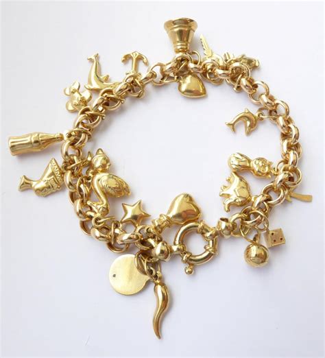 Lot 131 - A 9 Carat Gold Charm Bracelet, hung with